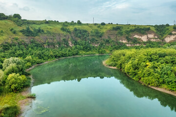 Fototapeta na wymiar Aerial view of a Bakota Bay, located over flooded Bakota village, part of the National Environmental Park Podilski Tovtry in Khmelnytskyi region, Ukraine. Travel destinations in Ukraine