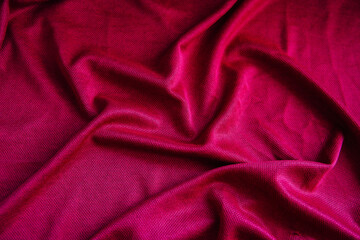 Bright pink, purple drapery fabric. A piece of matter with purple folds.