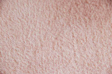 Pink fluffy fabric for drapery. A piece of warm cloth with folds.