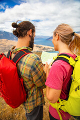 Lake Wakatipu Caucasian couple map reading New Zealand