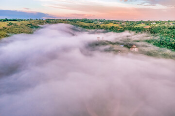 Aerial view drone shot of mountain tropical rainforest,Bird eye view image over the clouds Amazing nature background with clouds and mountain peaks