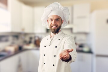 Bearded male chef in white uniform. Chef in white uniform, chef hat.