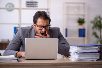 Young male employee working in the office