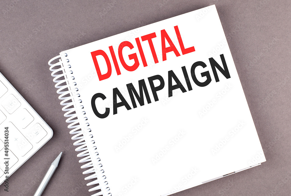 Poster digital campaign text on notebook with calculator and pen,business concept