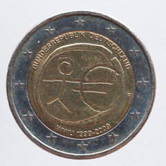 Germany - circa 2009: a 2 Euro coin of Germany with a human symbol and a Euro sign. 10 years Economic and Monetary Union EMU.