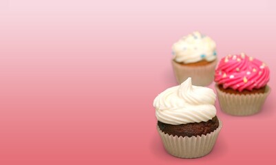 Sweet upcakes with cream cheese decorated with dried cinnamon powder. Homemade pastry