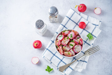 Roasted spiced radish with parsley in a bowl