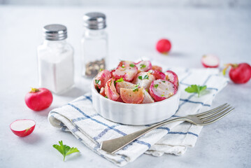 Roasted spiced radish with parsley in a bowl