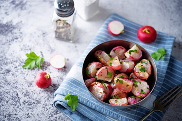 Roasted spiced radish with parsley in a bowl