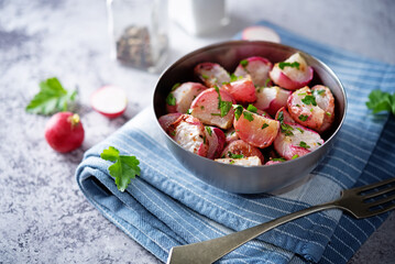 Roasted spiced radish with parsley in a bowl