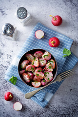 Roasted spiced radish with parsley in a bowl