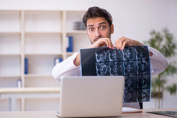 Young male doctor radiologist working in the clinic