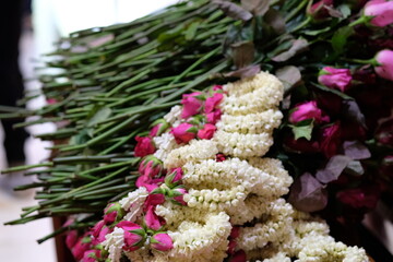 selective focus on thai jasmine with pink roses garlands