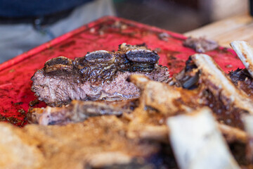 closeup asado of meat on the grill argentina stake in