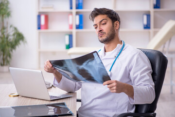 Young male doctor radiologist working in the clinic