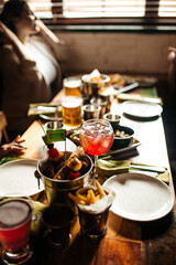 Table set with beer and salty snacks in a pub