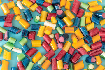 Multicolored bright chewy candies close-up, flat lay.