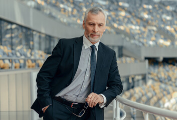 Portrait of mature businessman standing by the observation deck at stadium © Friends Stock