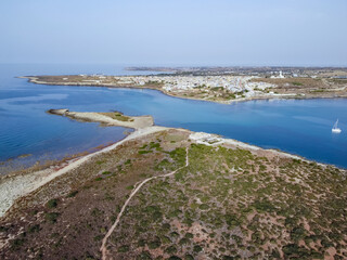 Aerial drone. Rocky coastline and island at Portopalo di Capo Passero, Siracusa Province, Sicily.
