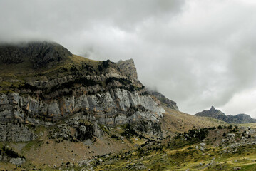 Fototapeta na wymiar Cloudy landscape of high mountains