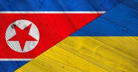 Background with North Korea flag of Ukraine on split wooden table. 3D Illustration