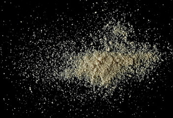 Sesame protein powder pile, organic muscle building supplement isolated on black background, top view