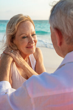 Loving retired couple on beach enjoying togetherness Bahamas