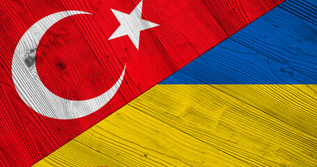 Background with flag of Turkey and Ukraine on split wooden table. 3D Illustration