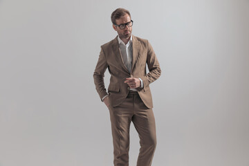 businessman with tough attitude is putting one hand in pocket