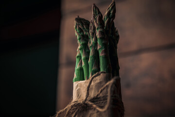 fresh bunch of asparagus tied with rope in a bow
