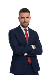 businessman posing with his arms crossed at chest