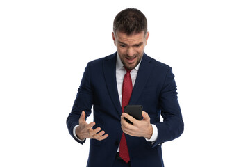 businessman feeling shocked over some text he received