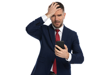 businessman slapping his head seeing what text he received