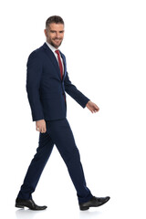 businessman walking to the side with a smile