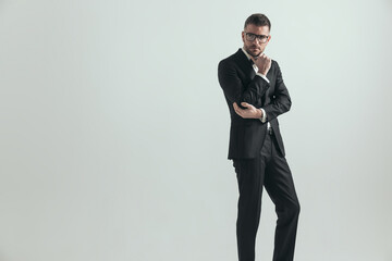 businessman in his middle age is holding his elbow