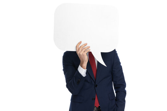 businessman hiding behind a speech bubble