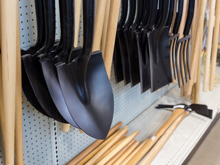 Selective focus of selection of gardening tools set in rows for sale in garden center 