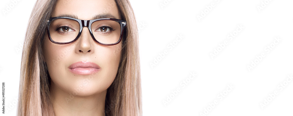 Wall mural women glasses and clear vision concept. close up of attractive woman face staring at camera with con