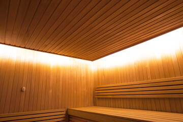 Wooden sauna, illuminated ceiling in a wooden room