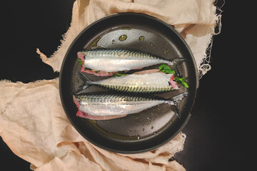Fresh peeled mackerel in a pan waiting for cooking, marinated fish