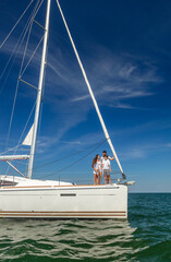Young Latino family on yacht enjoying tropical vacation