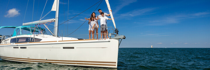 Panoramic Latin American family enjoying vacation on yacht