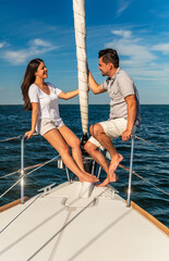 Obraz premium Successful Latino couple relaxing together on private yacht