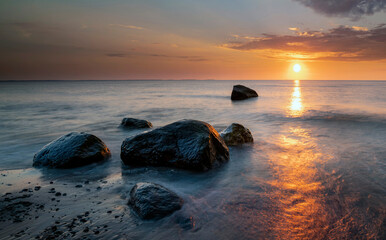 Sunset by the sea. Nature and nature landscape at sunset.