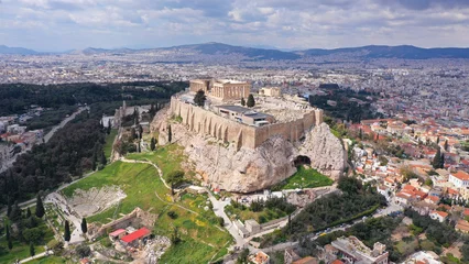Gardinen Aerial drone photo of unique Masterpiece of Ancient times the Parthenon on top of iconic Acropolis hill with cloudy sky, Athens, Attica, Greece © aerial-drone