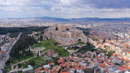 Aerial drone photo of unique Masterpiece of Ancient times the Parthenon on top of iconic Acropolis hill with cloudy sky, Athens, Attica, Greece - obrazy, fototapety, plakaty