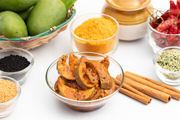 Mango Pickle Also Known As Aam Ka Achar, Aam Chunda, Maagaya, Avakaya, Urakaya, Kadumanga Achar Is Made Of Raw Unripe Green Mangoes And Assorted Indian Spices Masala. White Backgronund With Copy Space