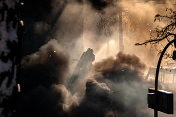 Smoke from fires and war on the streets in Kyiv