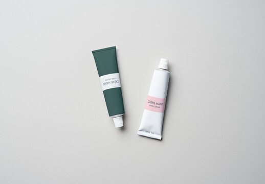 Two Cream Tubes Mockups on Gray Background
