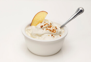 yogurt served with apple and nuts - 495533848